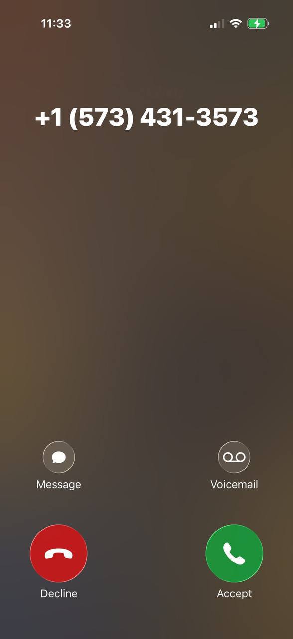 iPhone incoming call, +1 573-431-3573, no caller name, clock 11:33